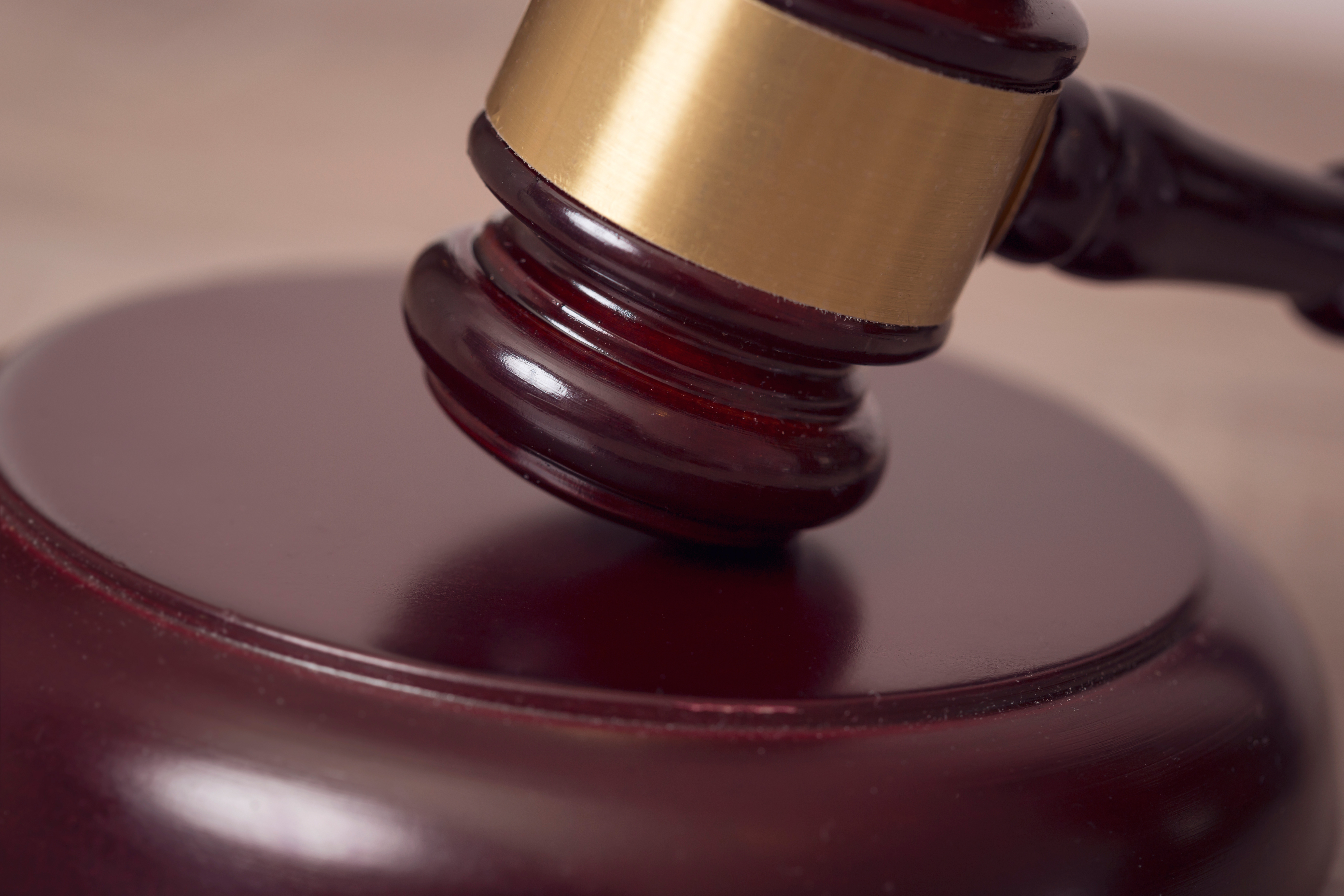 Close up of a judge gavel in a courtroom. Selective focus